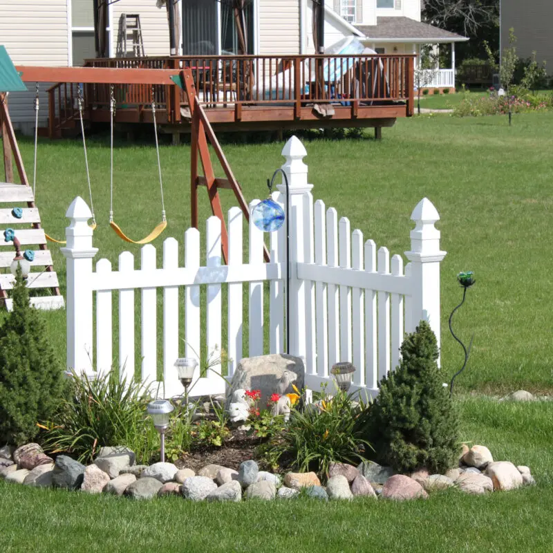 White fence garden installation backyard