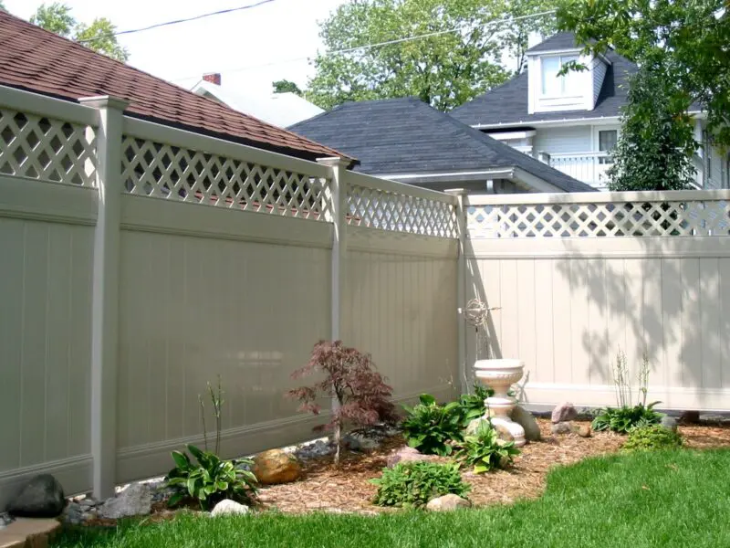Decorative white privacy fence installation