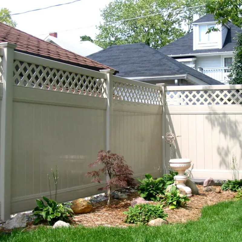 Decorative white privacy fence installation