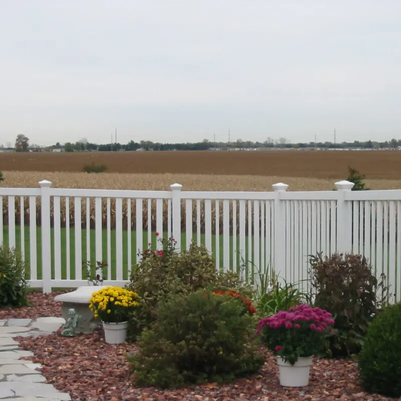 White fence with landscaped garden