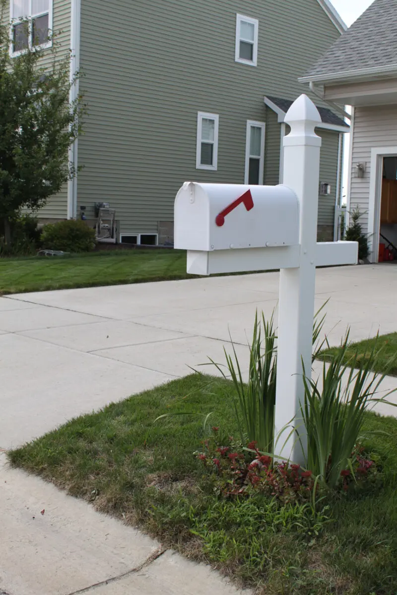 White mailbox on green lawn