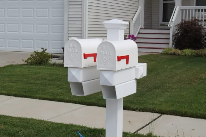 Dual white mailboxes front yard