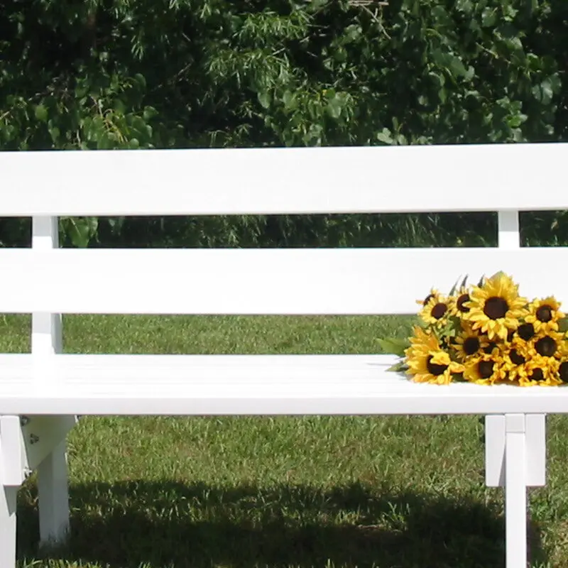 White garden bench sunflowers display