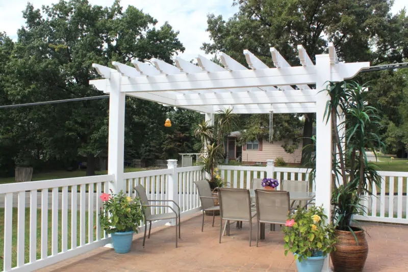 Outdoor deck with white pergola