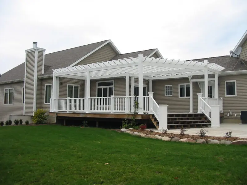 White pergola on wooden deck