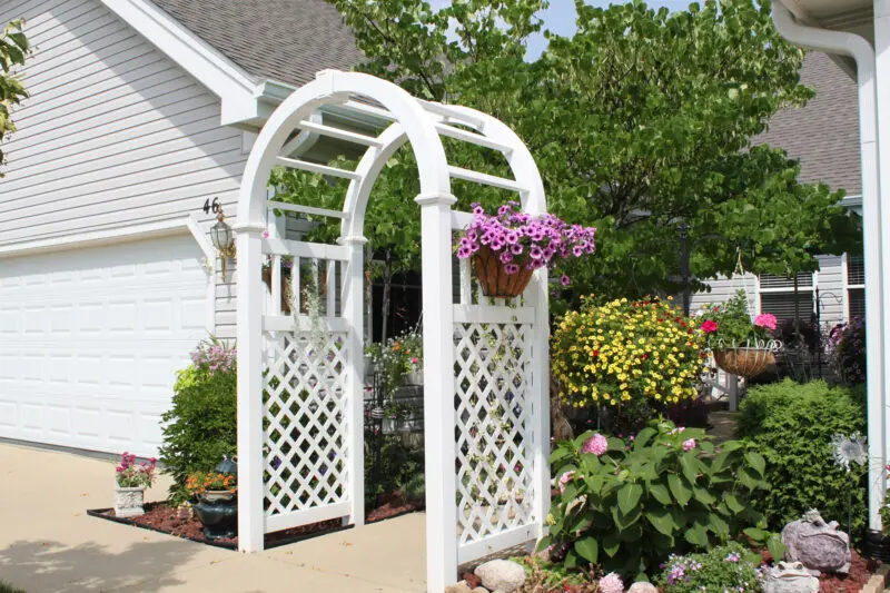 White garden arbor with flowers