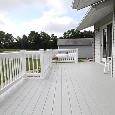 Spacious white deck with railing