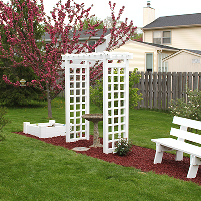 Garden arbor with white fencing