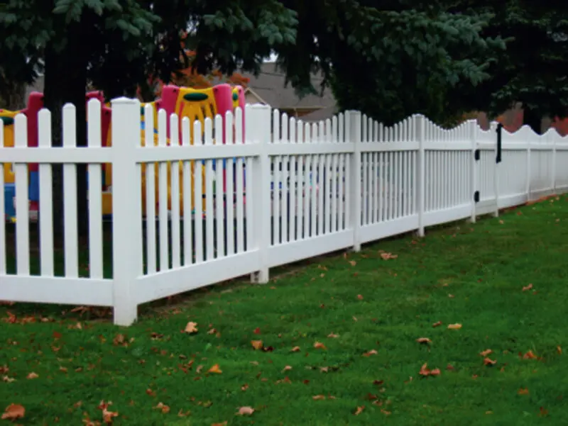 White picket fence grassy yard