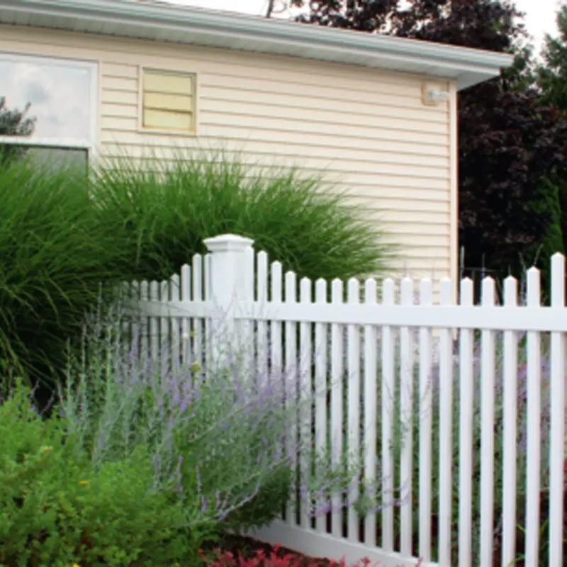 White garden fence with plants