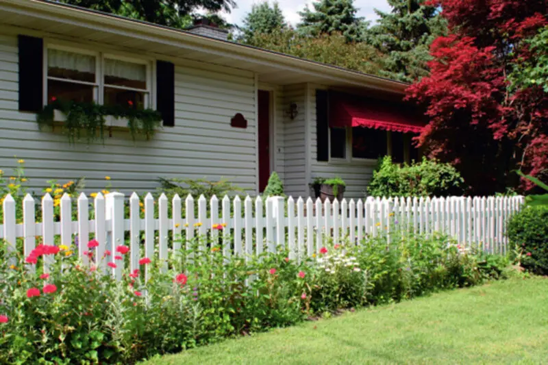 White picket fence garden landscaping