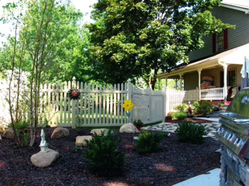 White picket fence garden installation