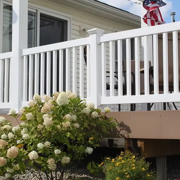 White railing deck installation flowers