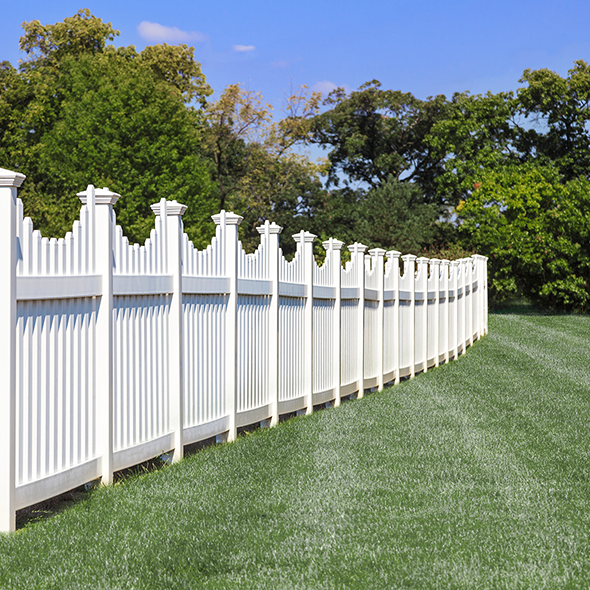 White vinyl fence on lawn