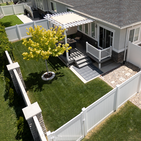 White fence surrounding cozy deck