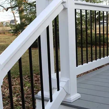 White deck railing installation outdoors