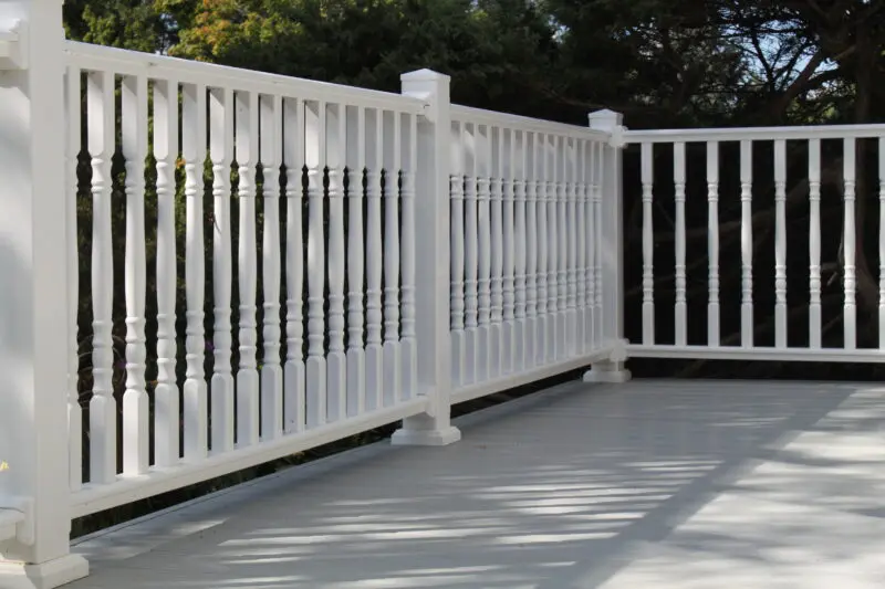White vinyl deck railing installation