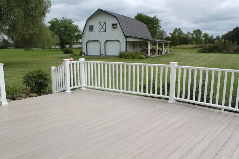 Spacious farm deck with railing