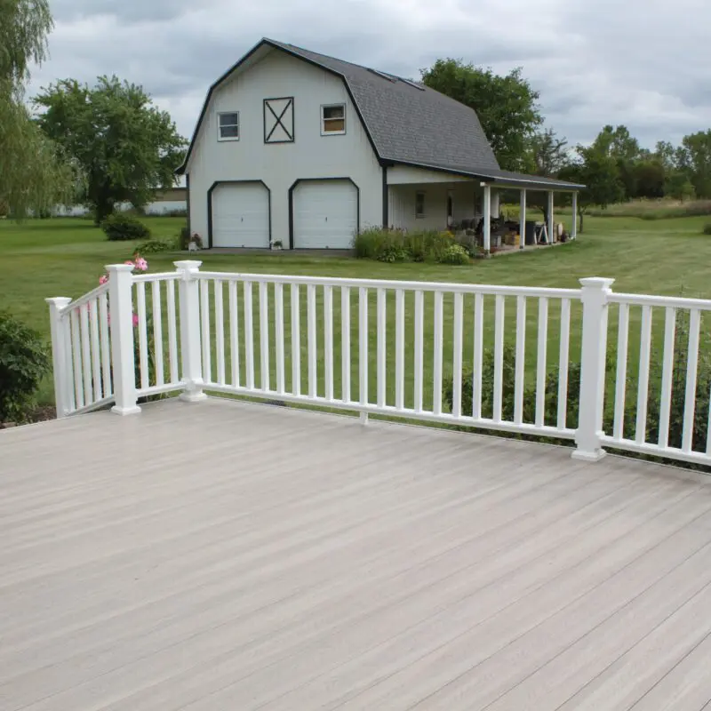 Spacious farm deck with railing