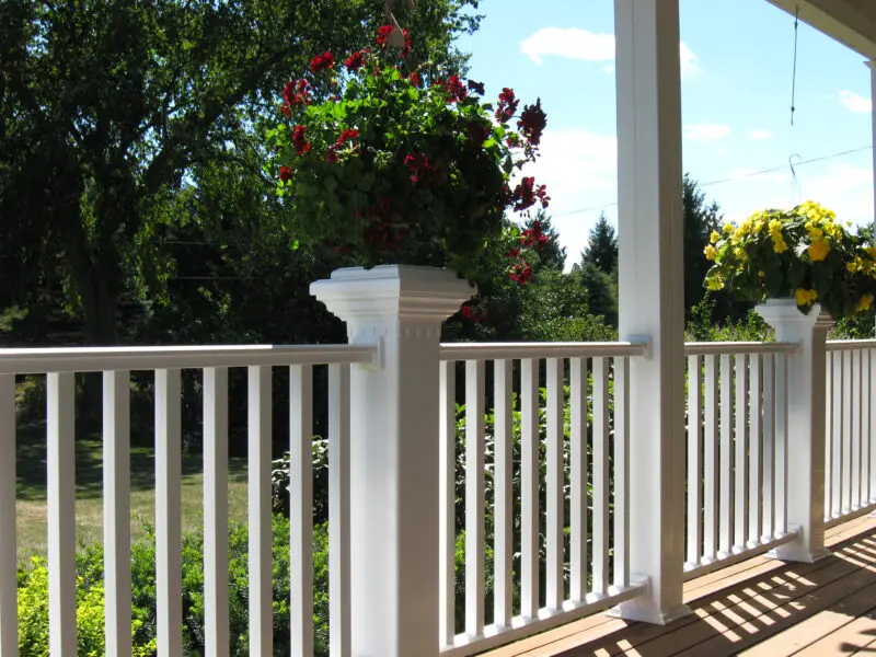 White deck railing with flowers