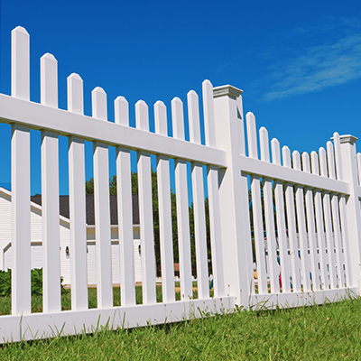 White picket fence installation outdoors