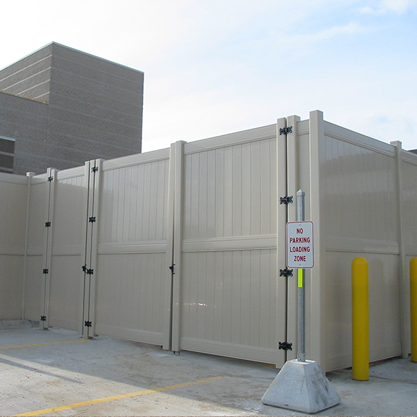 Commercial privacy fence installation site