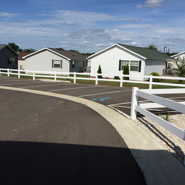 White vinyl fence surrounding houses
