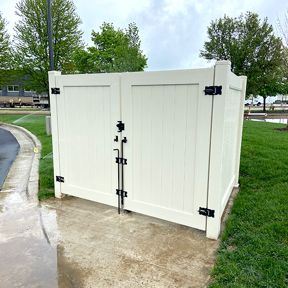 White privacy fence installation outdoors