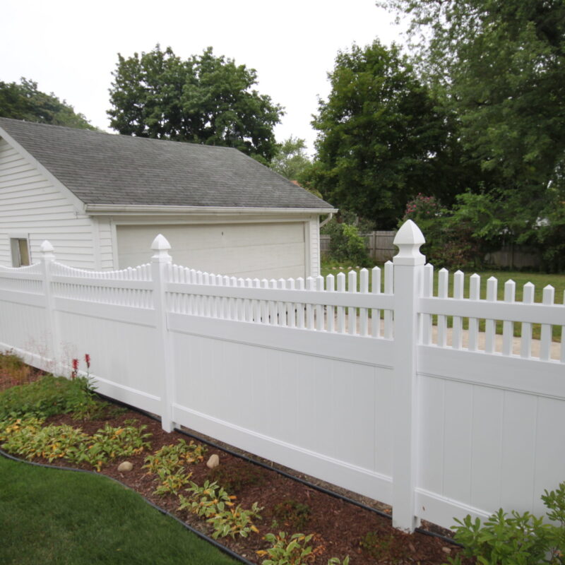 White vinyl fence backyard installation